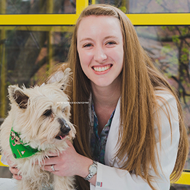 Dr. Catherine Donewald holding small white dog