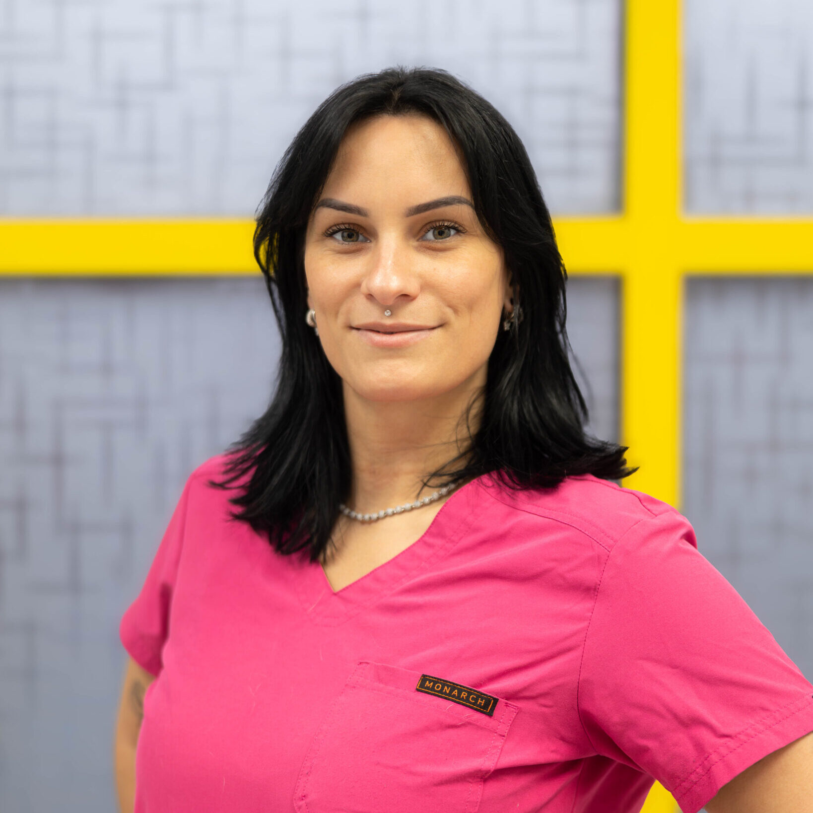 Nydia Tech Assistant Woman in pink scrubs smiling