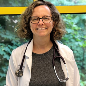 Jill Ocallaghan DVM smiling for team headshot